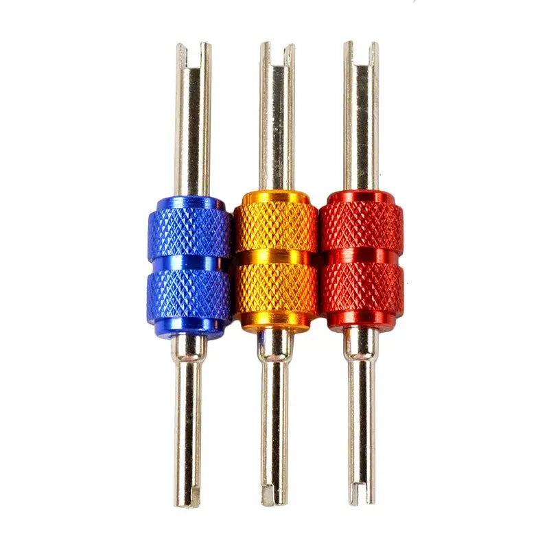 Simples Market valve core remover screwdriver set; three knurled metal stems in blue, orange, red.