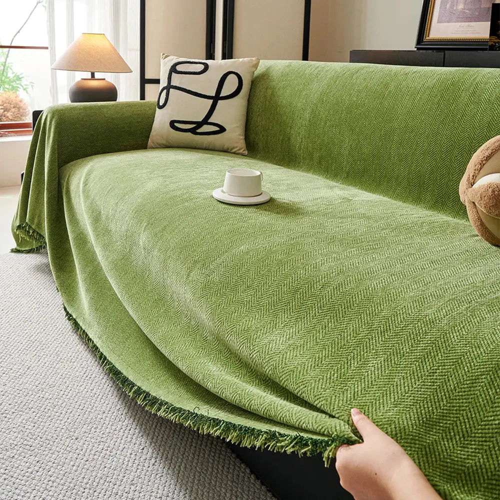 Couch cover in green chenille with fringe and herringbone texture; Simples Market heavyweight sofa blanket.