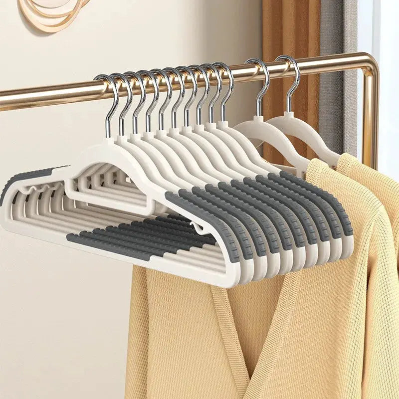 12 Simples Market plastic anti-slip hangers with gray grips on a metal clothing rack