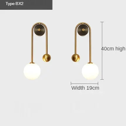 Modern wall lamp BX2 pair by Simples Market with gold metal arches and glass globe shades