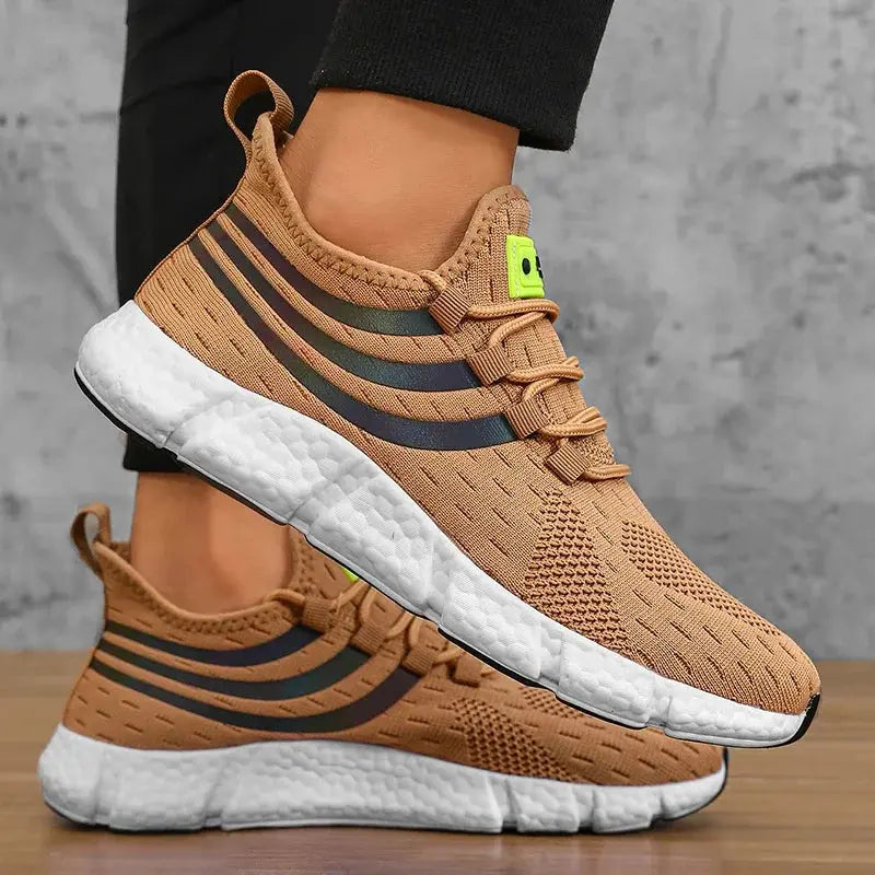 Pair of men's tan breathable knit sneakers with white foam sole and black side stripes