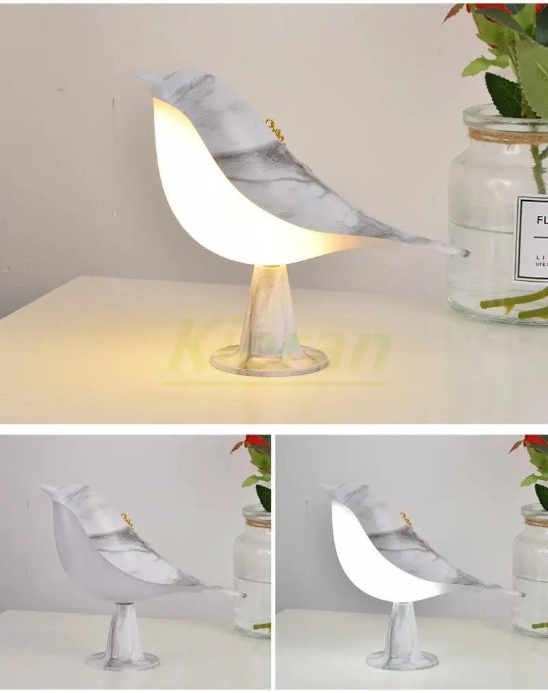 Magpie LED desk lamp with marble-pattern wing, touch control, warm glow on pedestal base