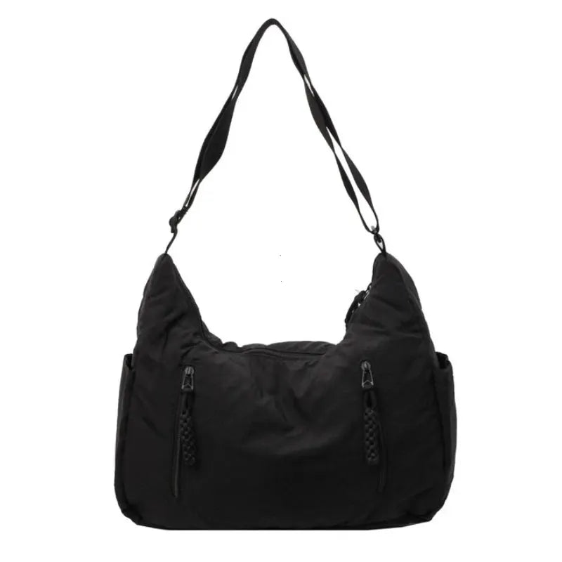 Trendy women's soft cloth shoulder bag in black with two front zip pockets and crossbody strap, Simples Market