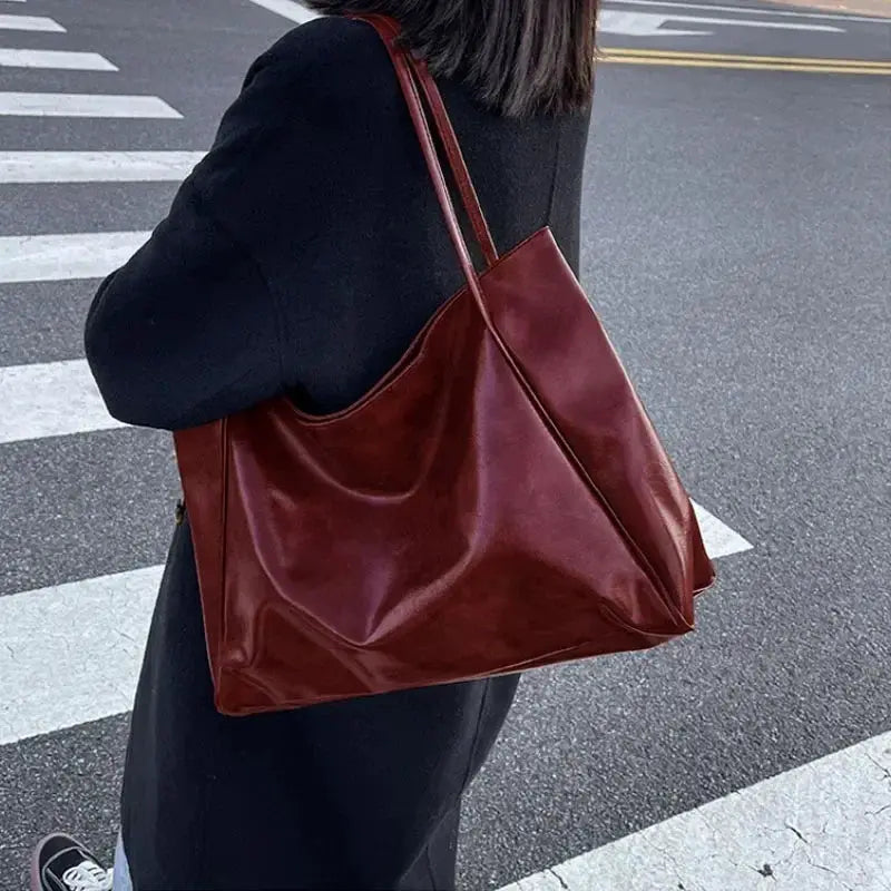 Simples Market women's burgundy PU leather tote bag with shoulder straps, large capacity.
