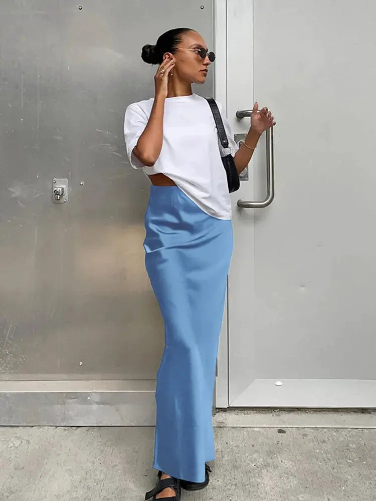 Satin blue trumpet skirt, high-waisted and long, office-ready women's fashion.