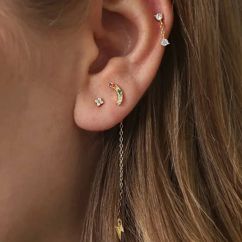 Simples Market 3pc 925 silver zircon earrings worn on ear: tiny flower stud, rainbow curved bar, long chain drop.