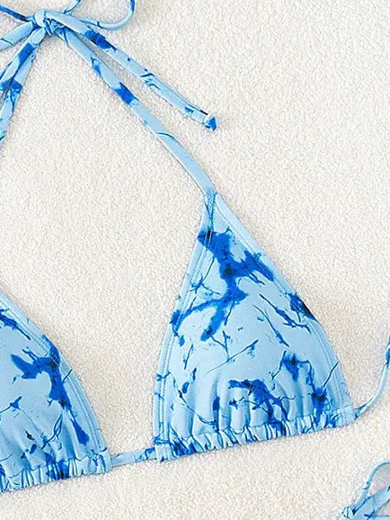 Triangle bikini top in blue floral print with adjustable tie straps