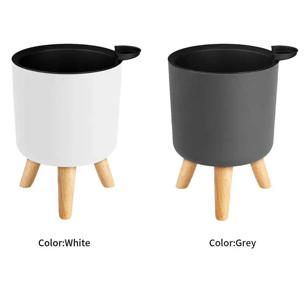 Floor-standing round flower pots on wooden legs in white and grey, two-piece set by Simples Market
