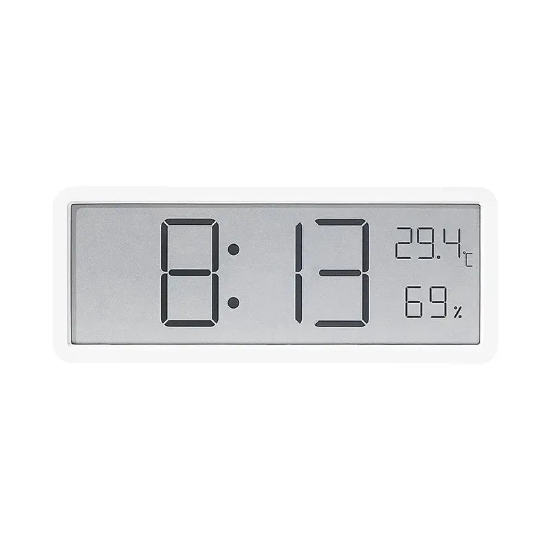 LCD digital desktop clock by Simples Market with white frame, showing time, 29.4°C and 69% humidity