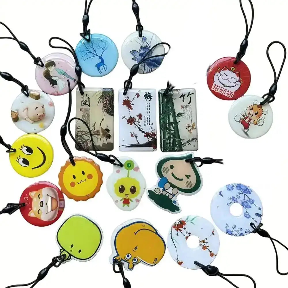 RFID EM4305/T5577 125KHz key tags and round/card fobs in assorted colorful designs.