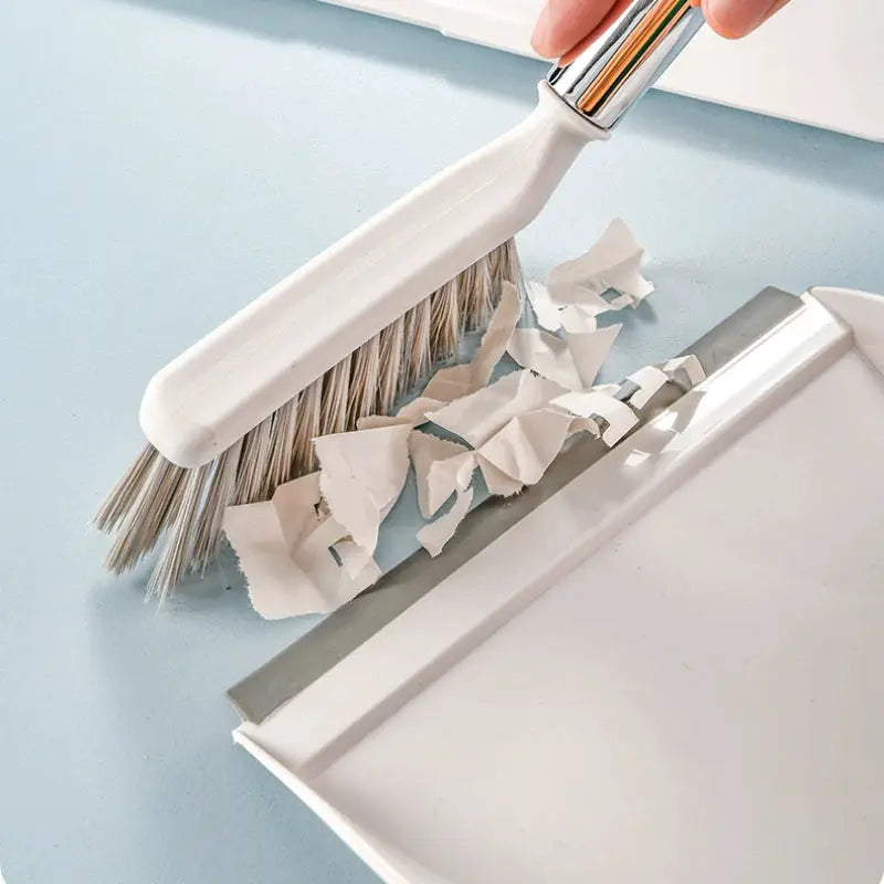 Desktop broom set by Simples Market with a compact white broom and dustpan for easy storage