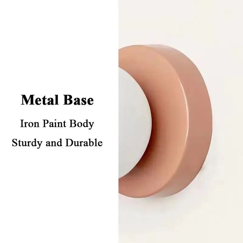 Macaron wall lamp by Simples Market; iron base with pink plastic ball lampshade, modern sconce