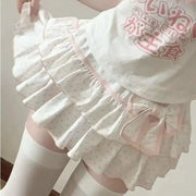 Harajuku Girls Lolita mini skirt in white with pink polka dots, layered ruffles and pink bow trim