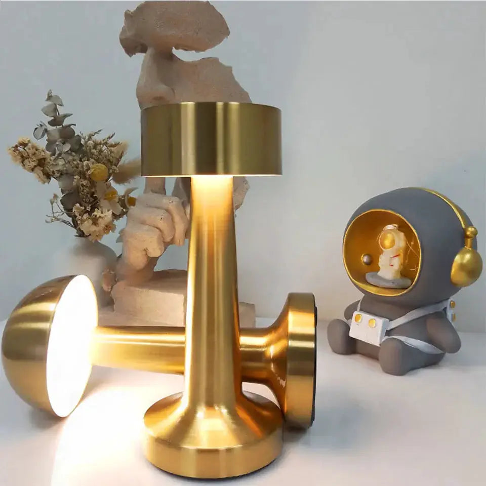 LED table light in gold metal finish with touch control; rechargeable decorative lamp for bar or coffee table