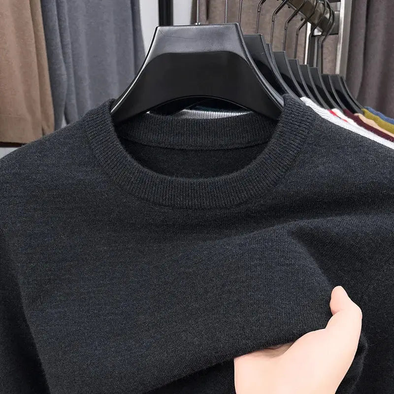 Men's black knitted crew-neck sweater on a hanger, long-sleeve casual top