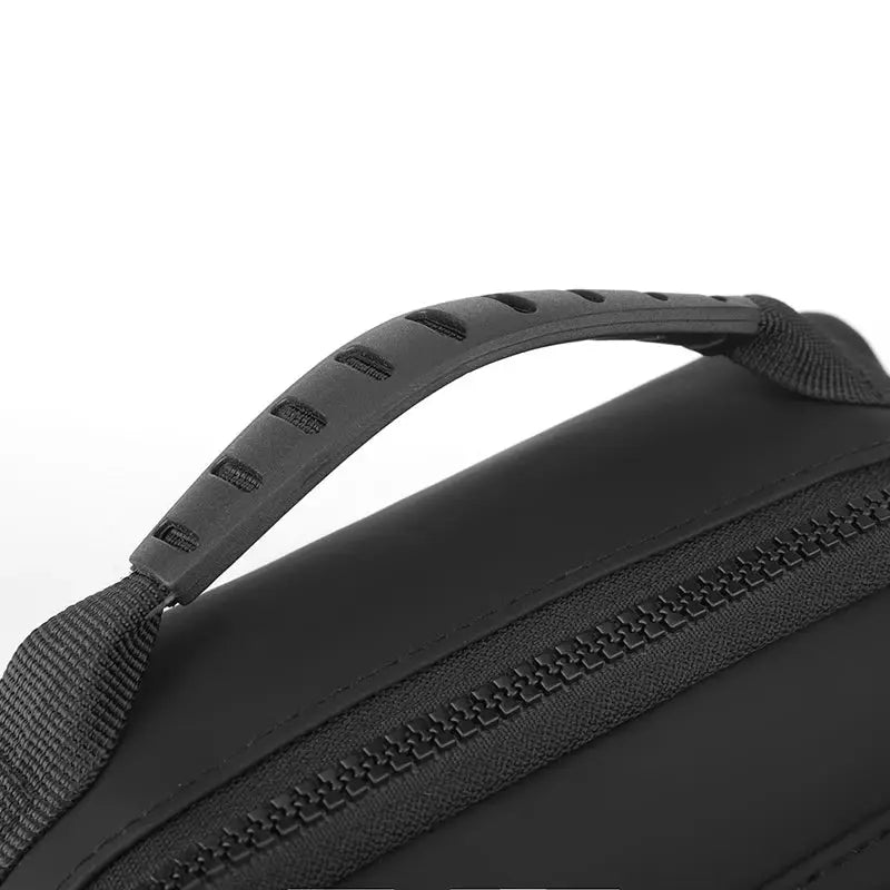 Messenger sling bag in black with top handle and zipper for crossbody use