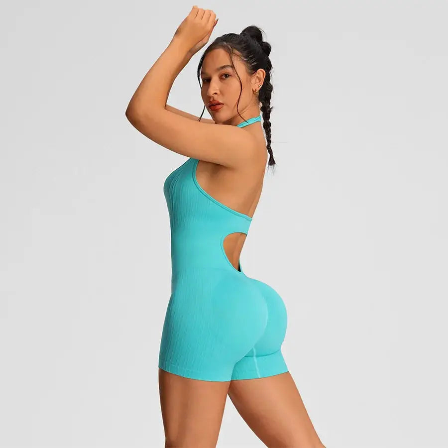 Women’s turquoise gym romper jumpsuit with side cutout and halter neck