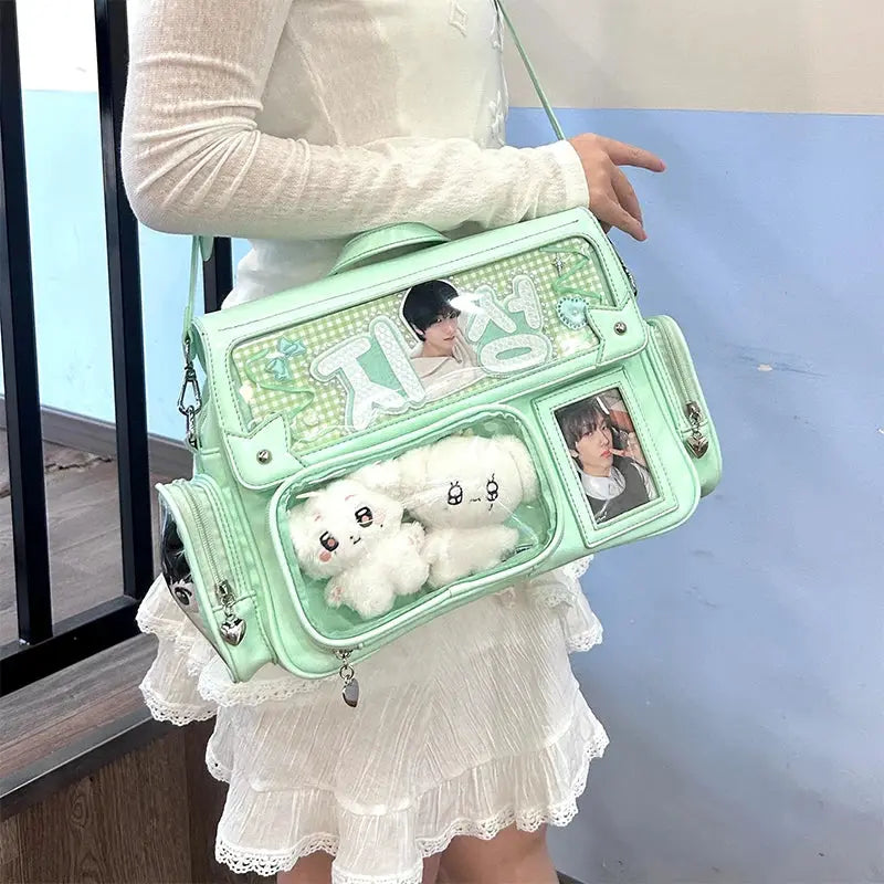 Ita bag crossbody in mint green with transparent pockets for photos and plush toys
