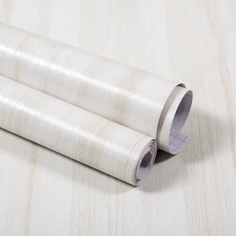 Vinyl self-adhesive wood wallpaper rolls (2) in light wood grain, waterproof PVC for walls and furniture.
