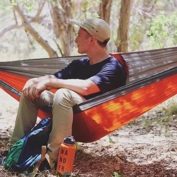 Outdoor single camping hammock by Simples Market, orange nylon parachute fabric, high-strength portable hanging bed.