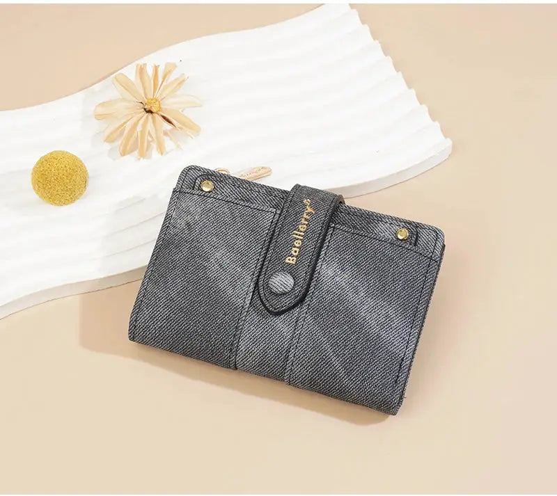 Baellerry denim women's short wallet with strap, blue textured fabric and gold branding