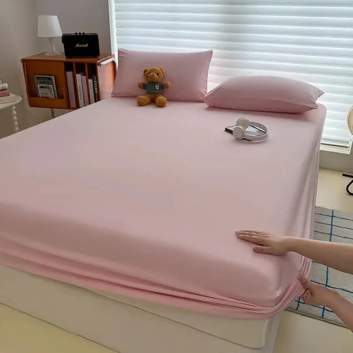 Washed pink fitted sheet with elastic bands; non-slip mattress cover for single, double, king/queen beds.