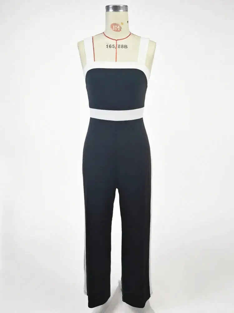 Women's black and white jumpsuit with square neckline and white waist belt on mannequin