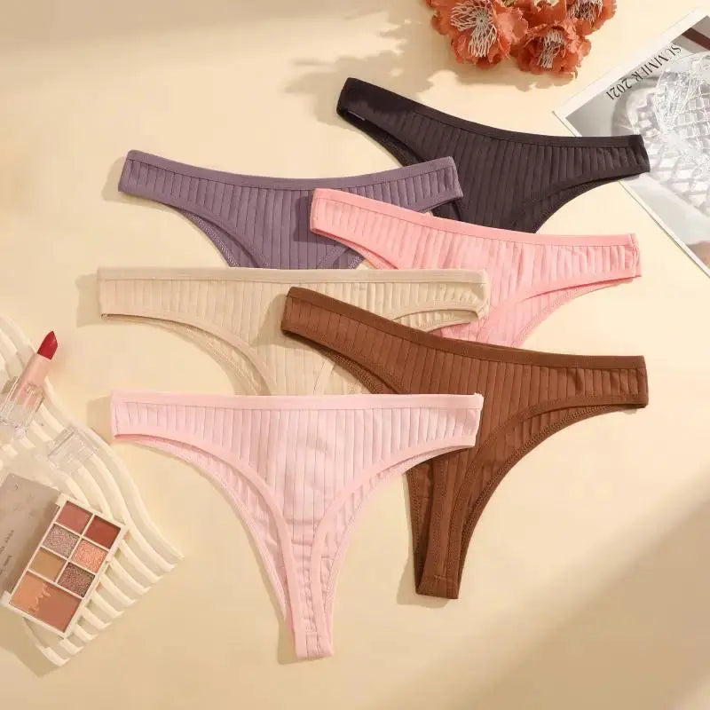 8-piece cotton seamless thong set for women by Simples Market in assorted solid colors.