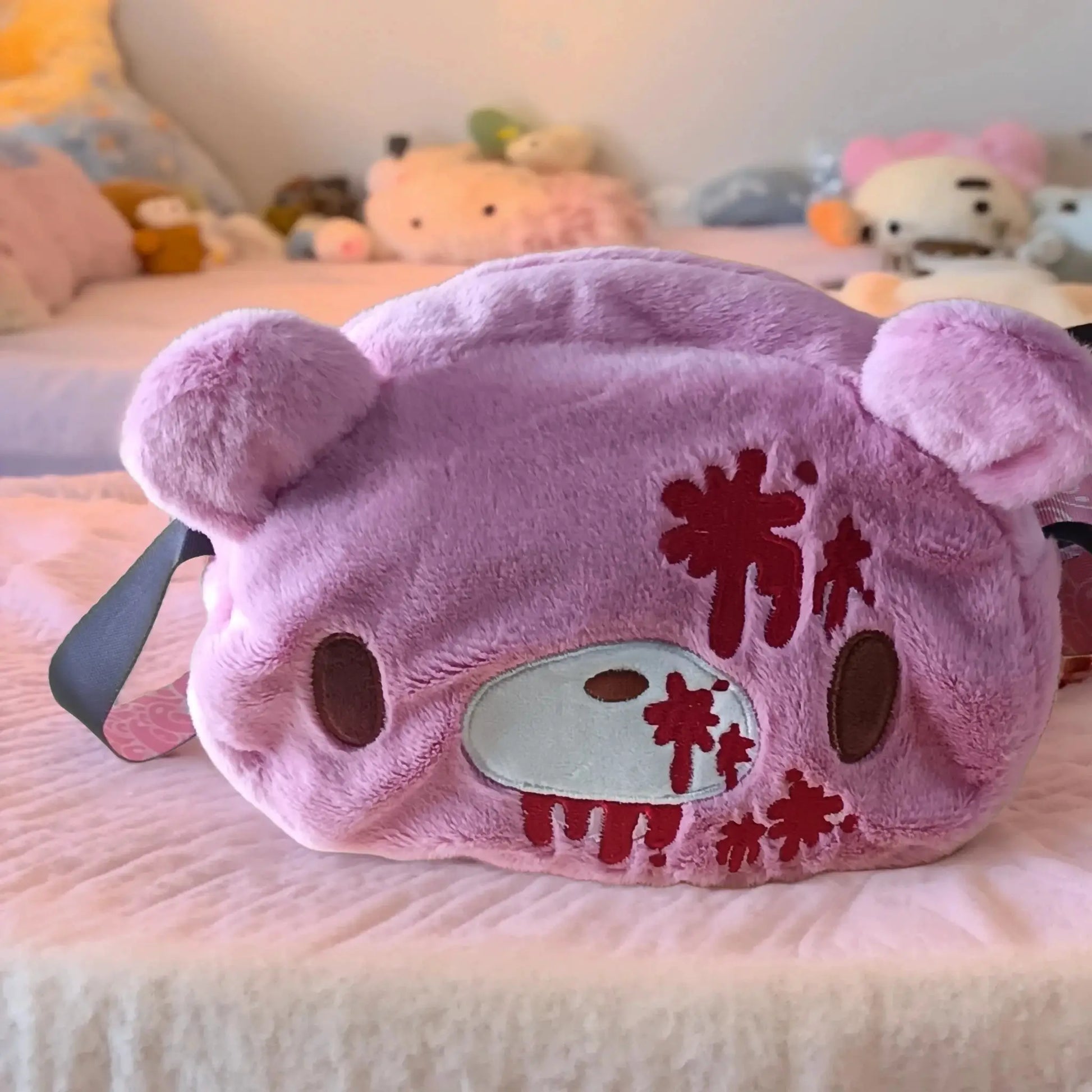 Gloomy Bear plush crossbody bag, pink with red blood-splatter embroidery and light blue strap