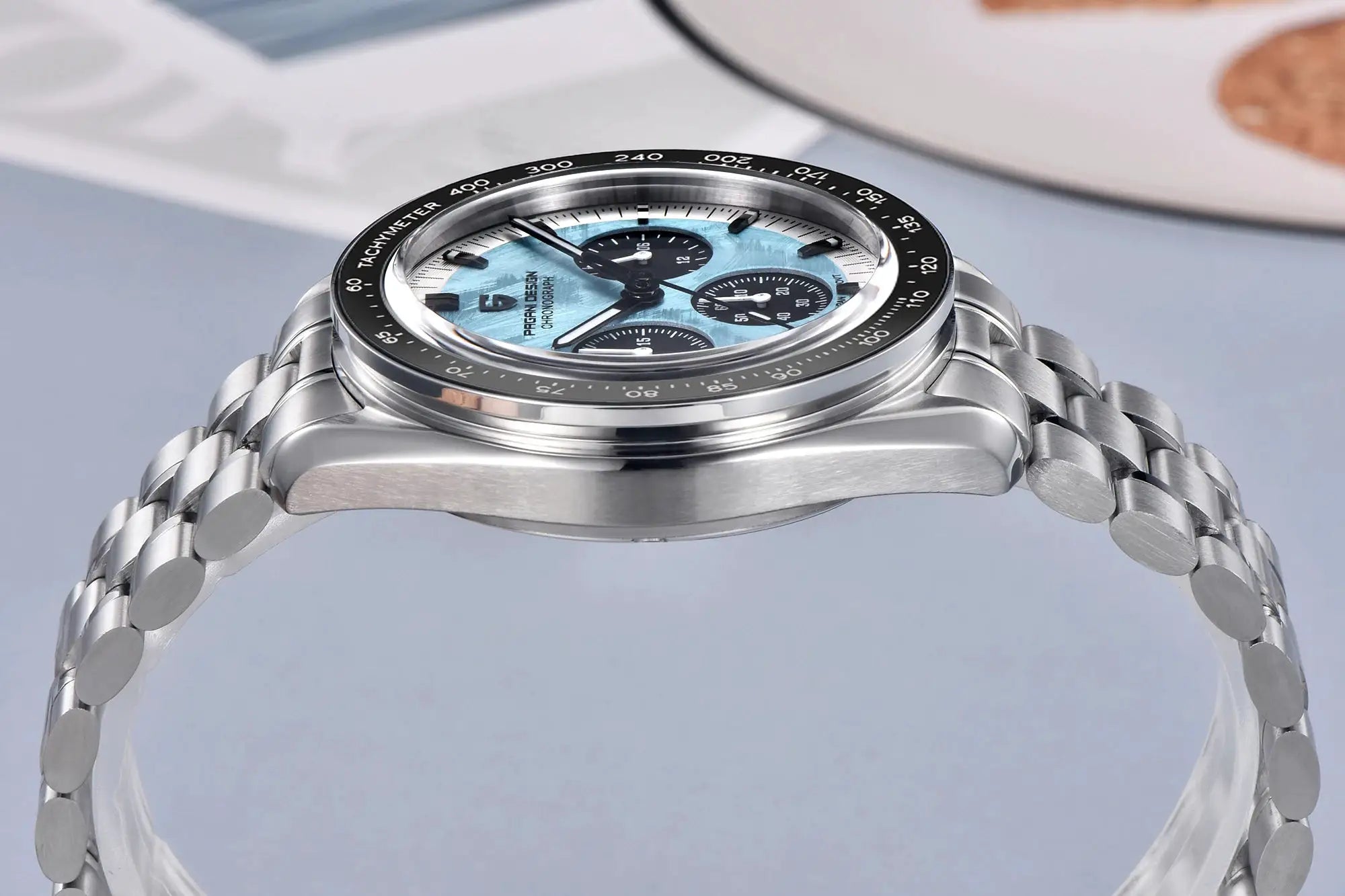 PAGANI DESIGN VK63 chronograph watch for men with blue dial and subdials, stainless steel bracelet, tachymeter bezel.