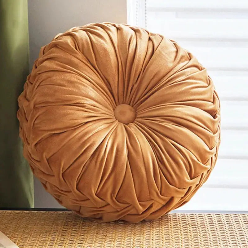 Round throw pillow with hand-sewn pleated Dutch velvet, pumpkin-style cushion in warm tan for sofa or chair.