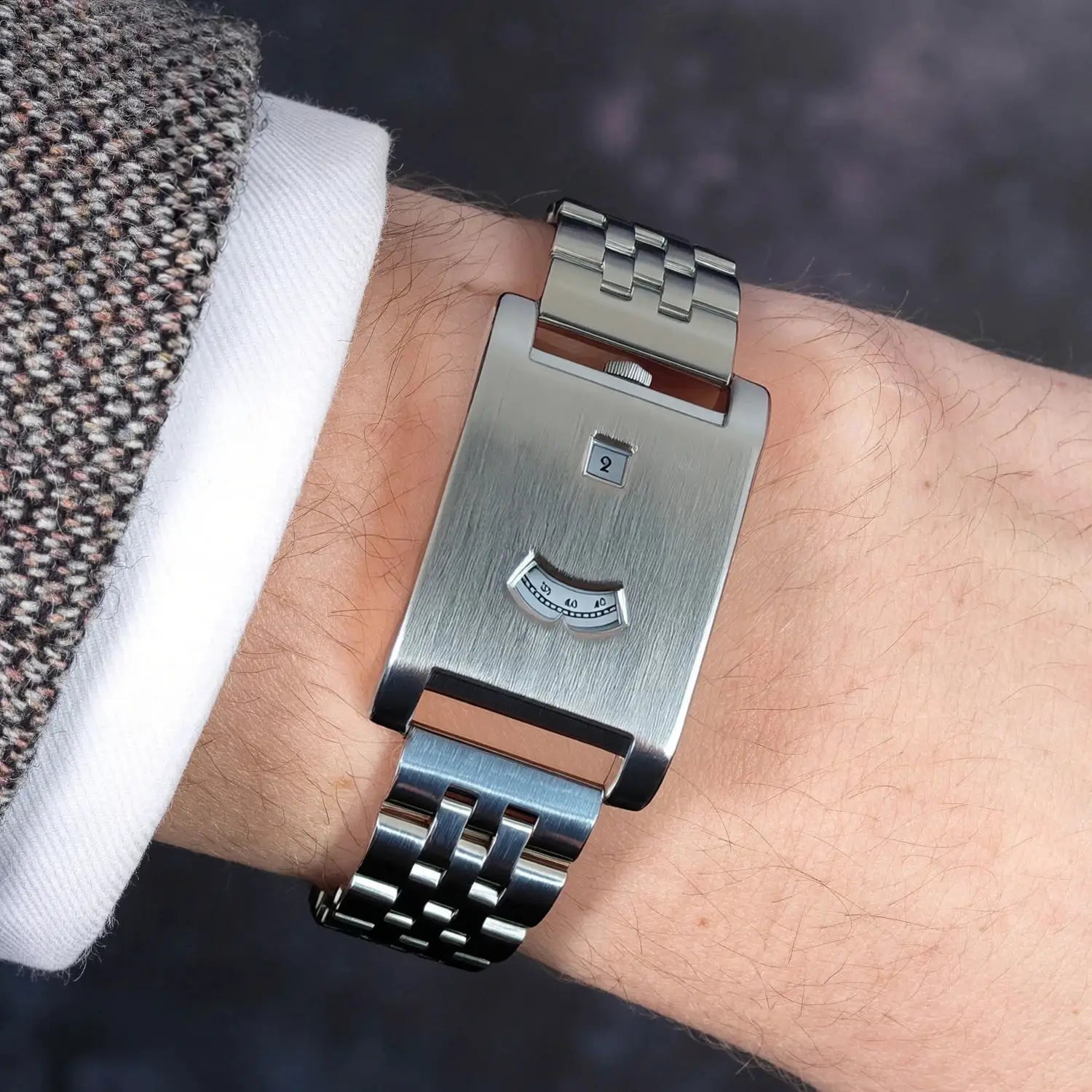 Men's square stainless steel quartz watch with brushed finish and two-tone bracelet with gold center links.