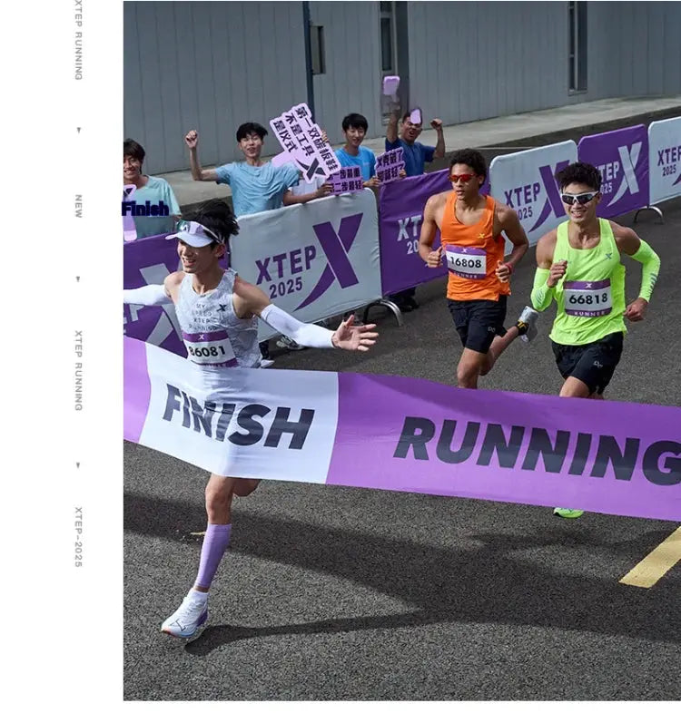 Xtep Shyft 1.0 men's running shoes at race finish with four runners and purple Xtep banners