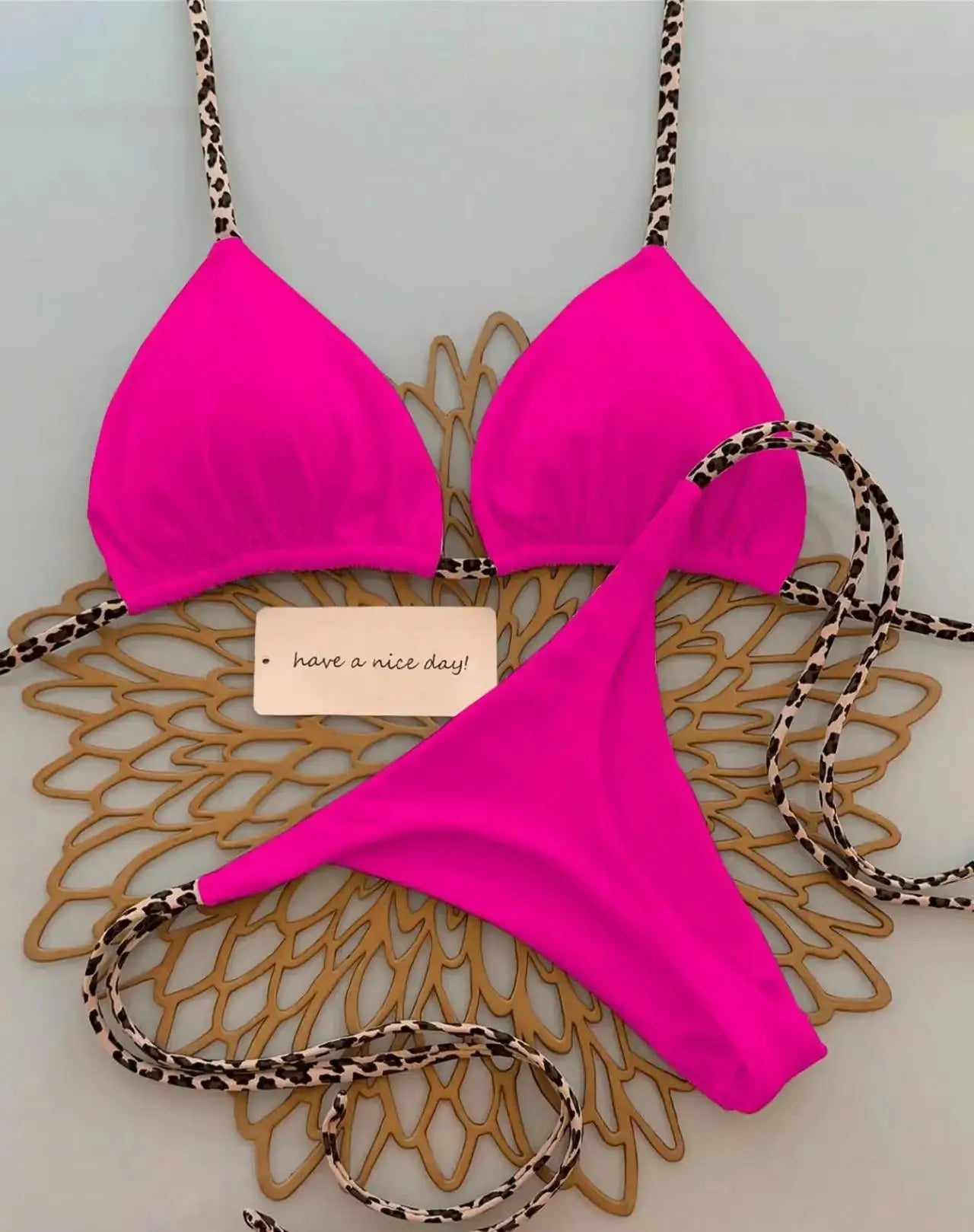 Simples Market neon pink leopard-print bikini set with triangle top and thong bottom leopard straps