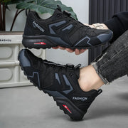 Pair of men's outdoor casual shoes in black with gray panels and rugged soles