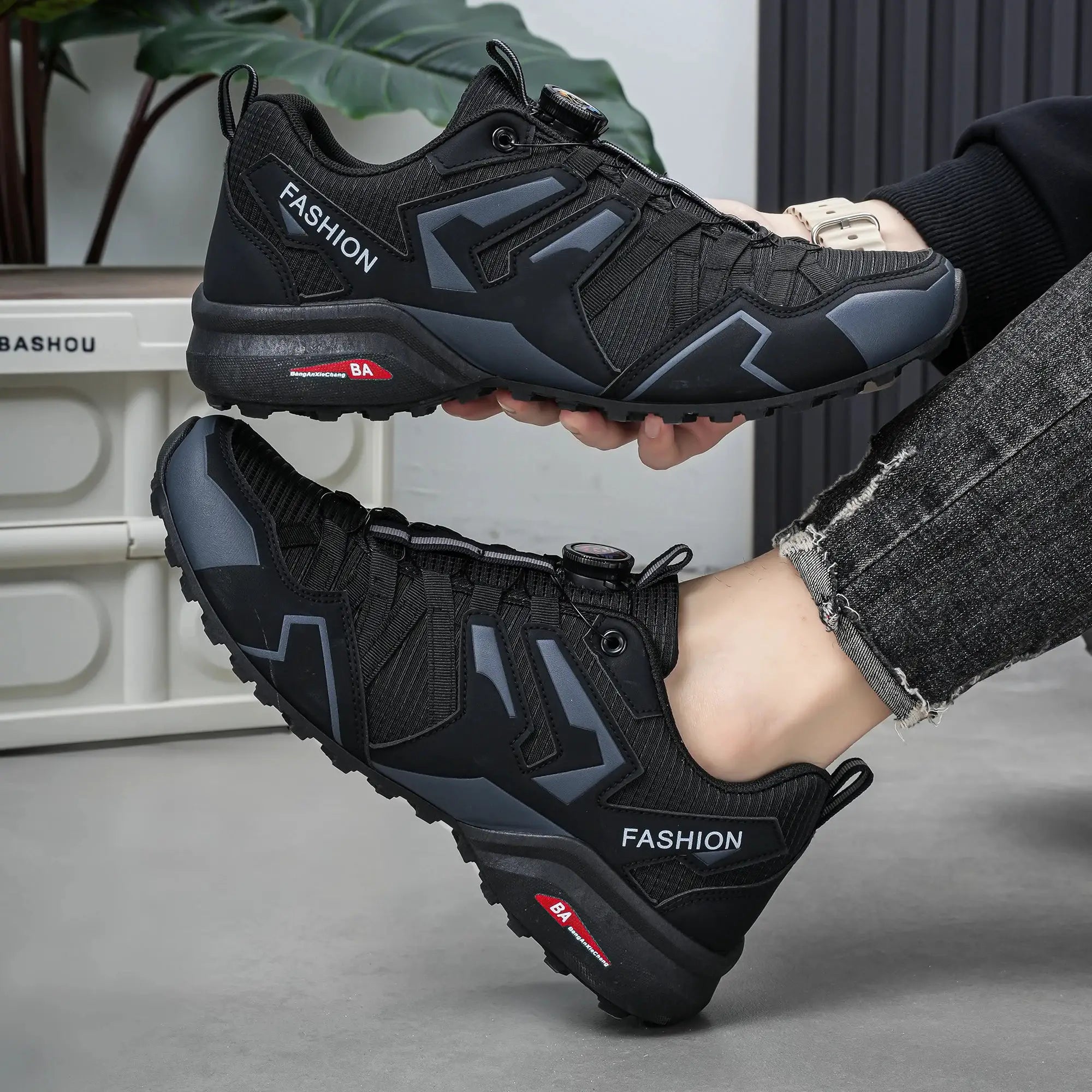 Pair of men's outdoor casual shoes in black with gray panels and rugged soles
