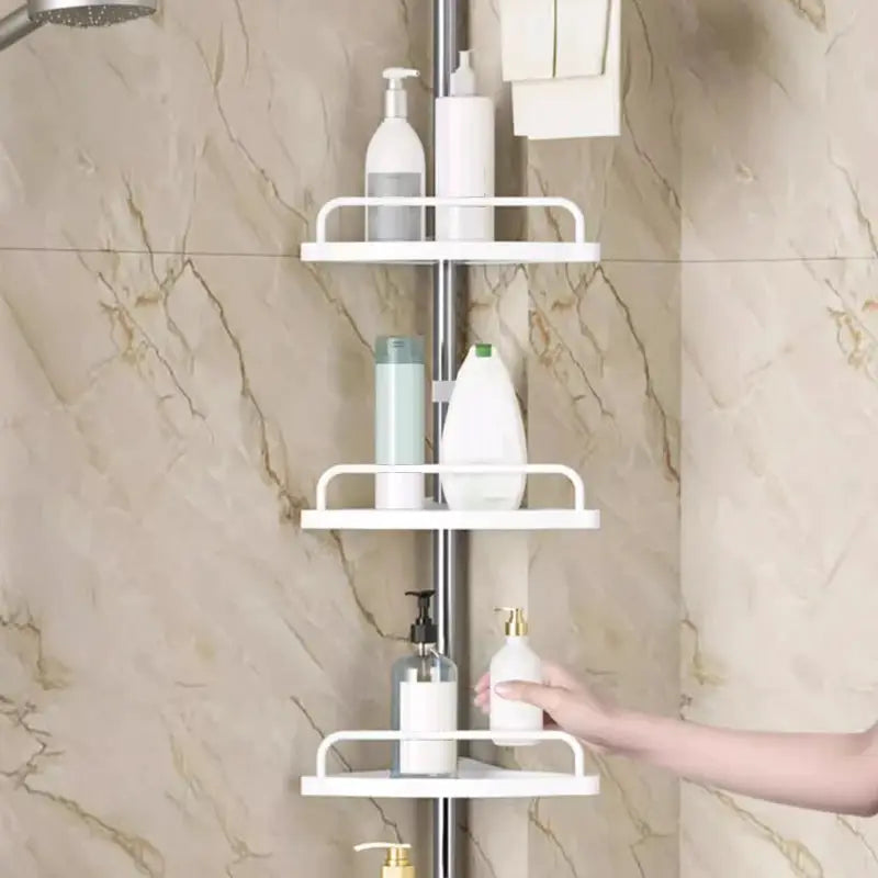 Stainless steel shower corner storage rack with four white shelves; telescopic, punch‑free, Simples Market.