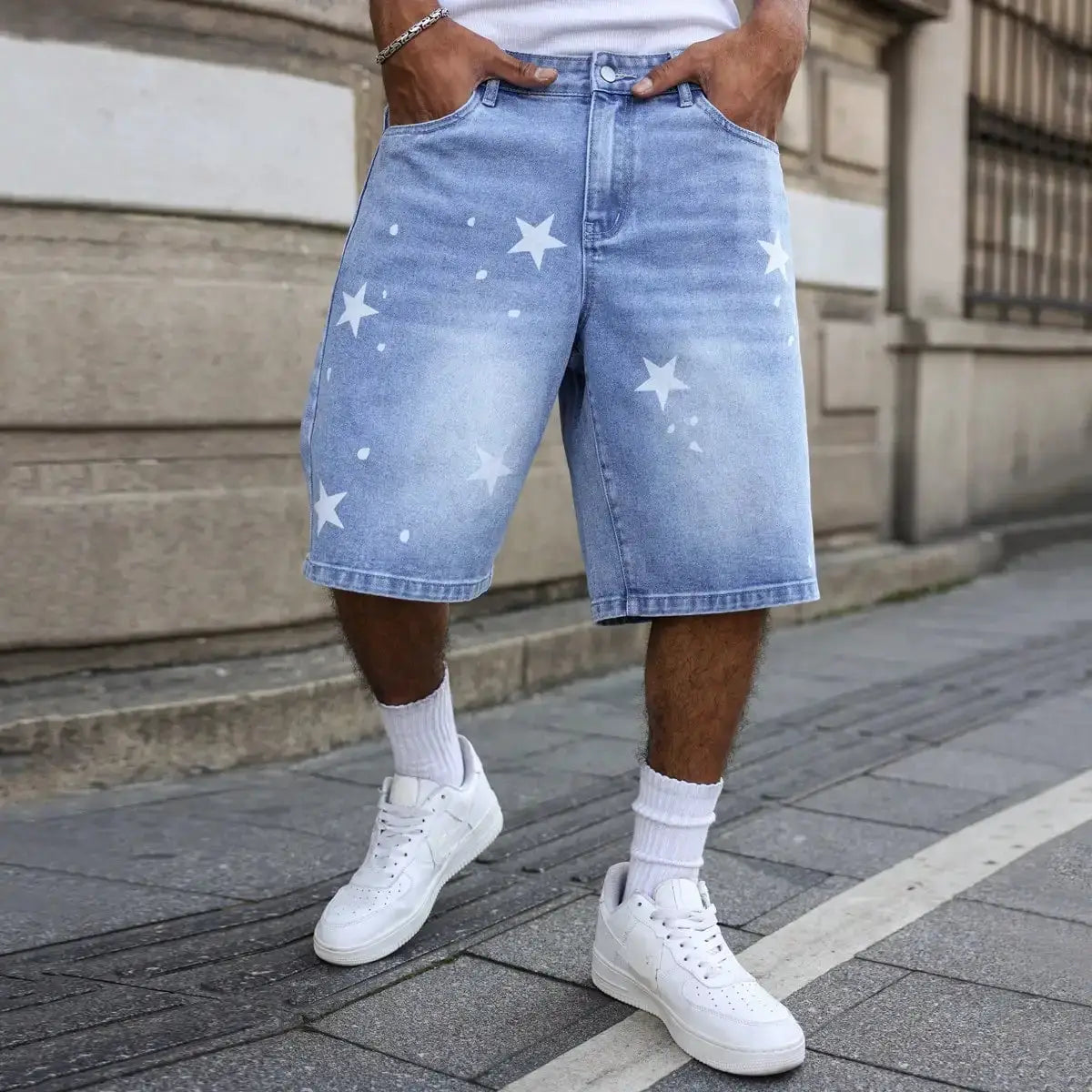 Men's blue denim shorts by Simples Market with white star prints on legs
