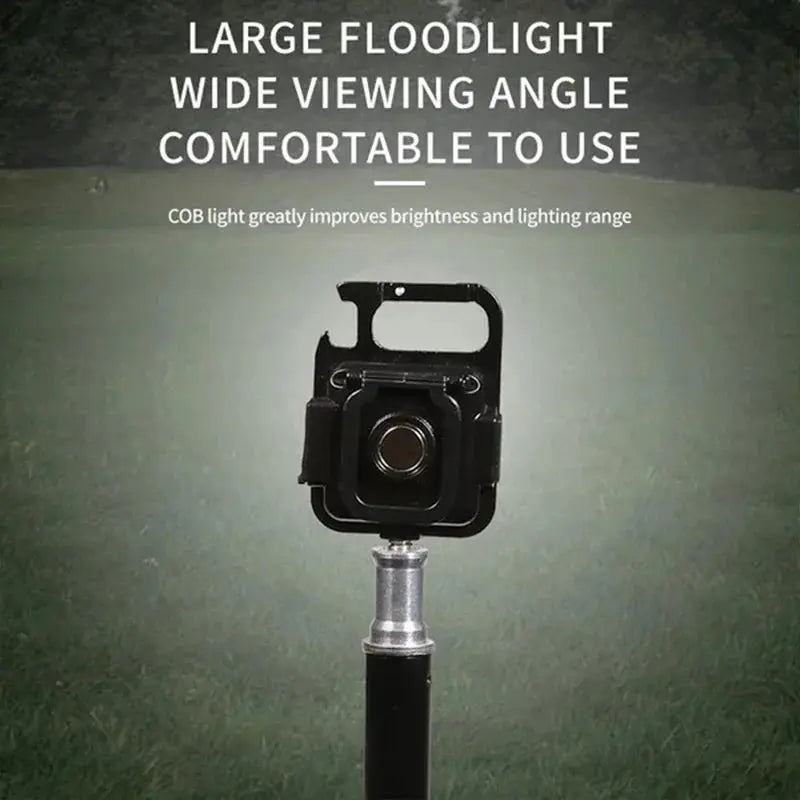Keychain USB camping flashlight with COB LED in black housing, portable lantern