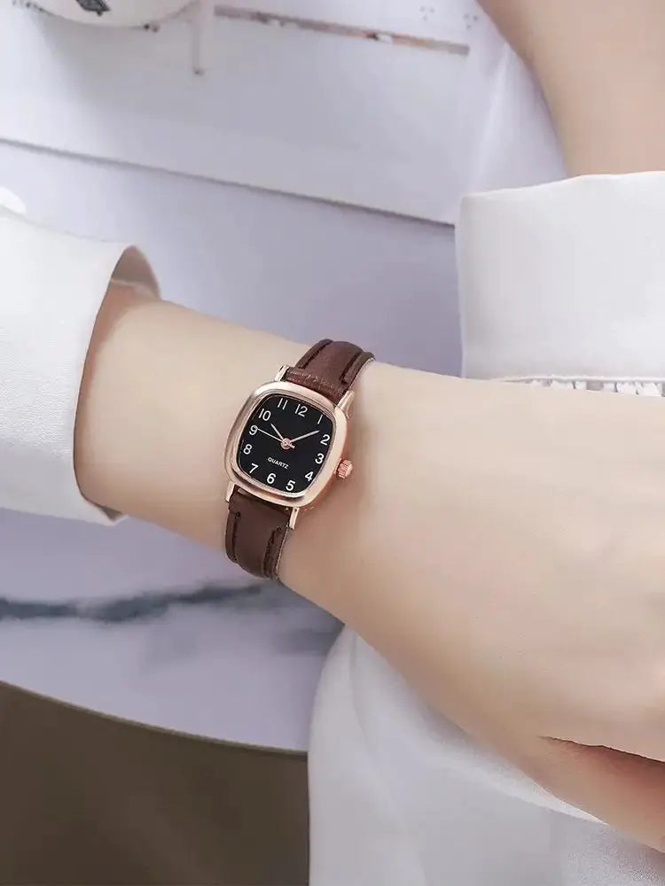 Women's watch with brown leather strap, rose-gold case, black dial and white Arabic numerals