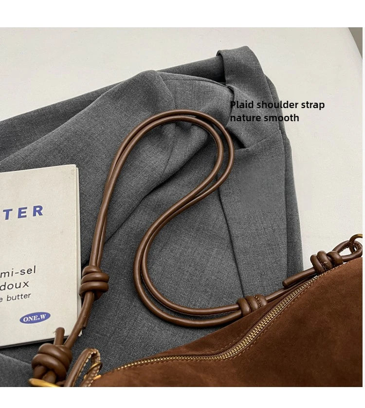 Faux suede shoulder bag in brown with double-loop crossbody strap by Simples Market