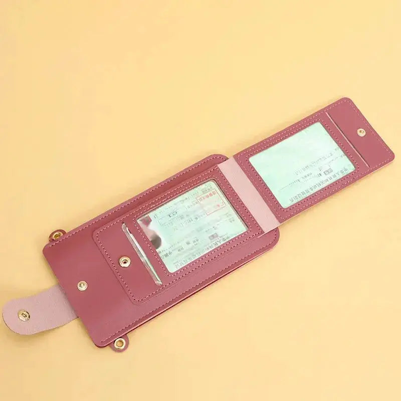 Women's pink soft leather crossbody wallet with clear ID windows and card slots