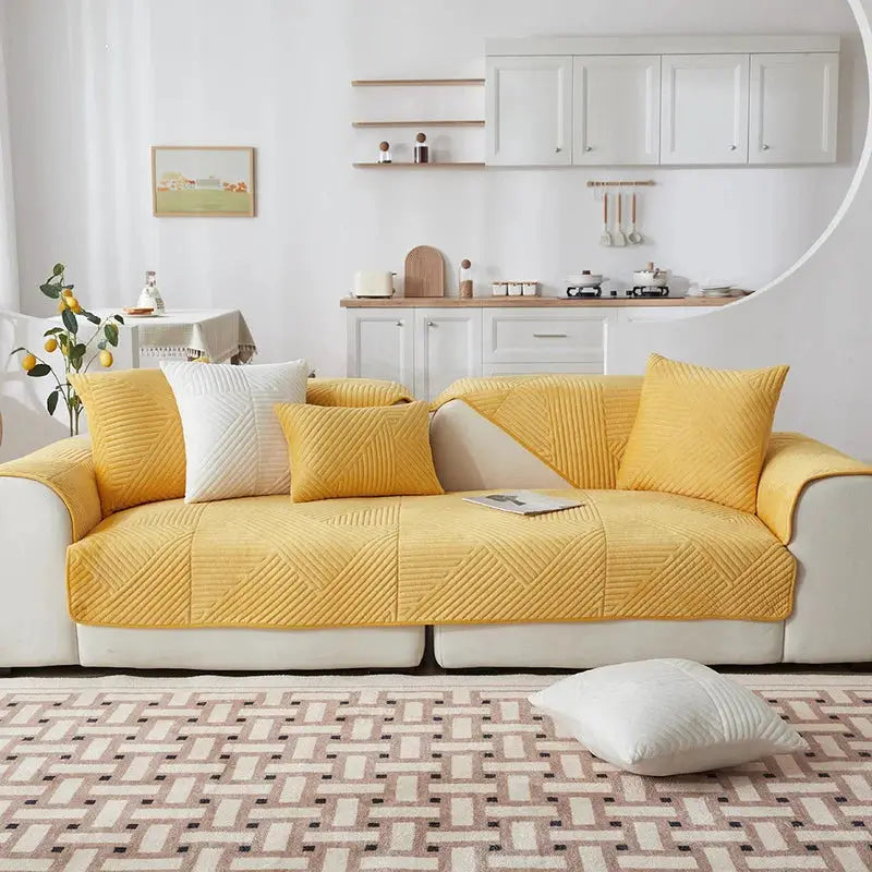 Crystal velvet sofa cover in mustard yellow with geometric quilted pattern for living room