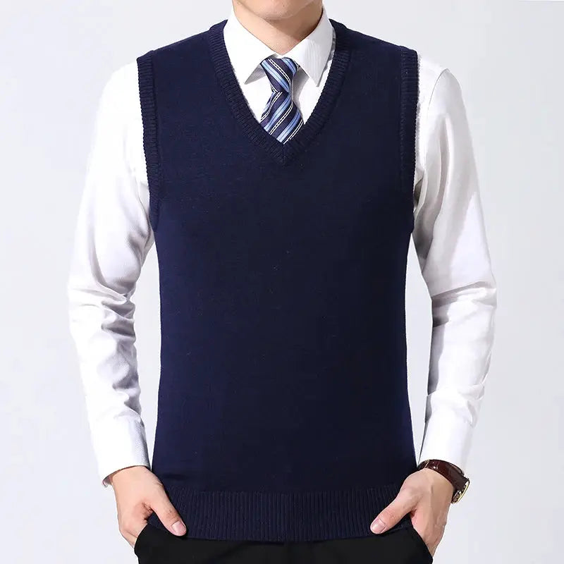 Men's casual navy knit sweater vest by Simples Market over white dress shirt and striped tie