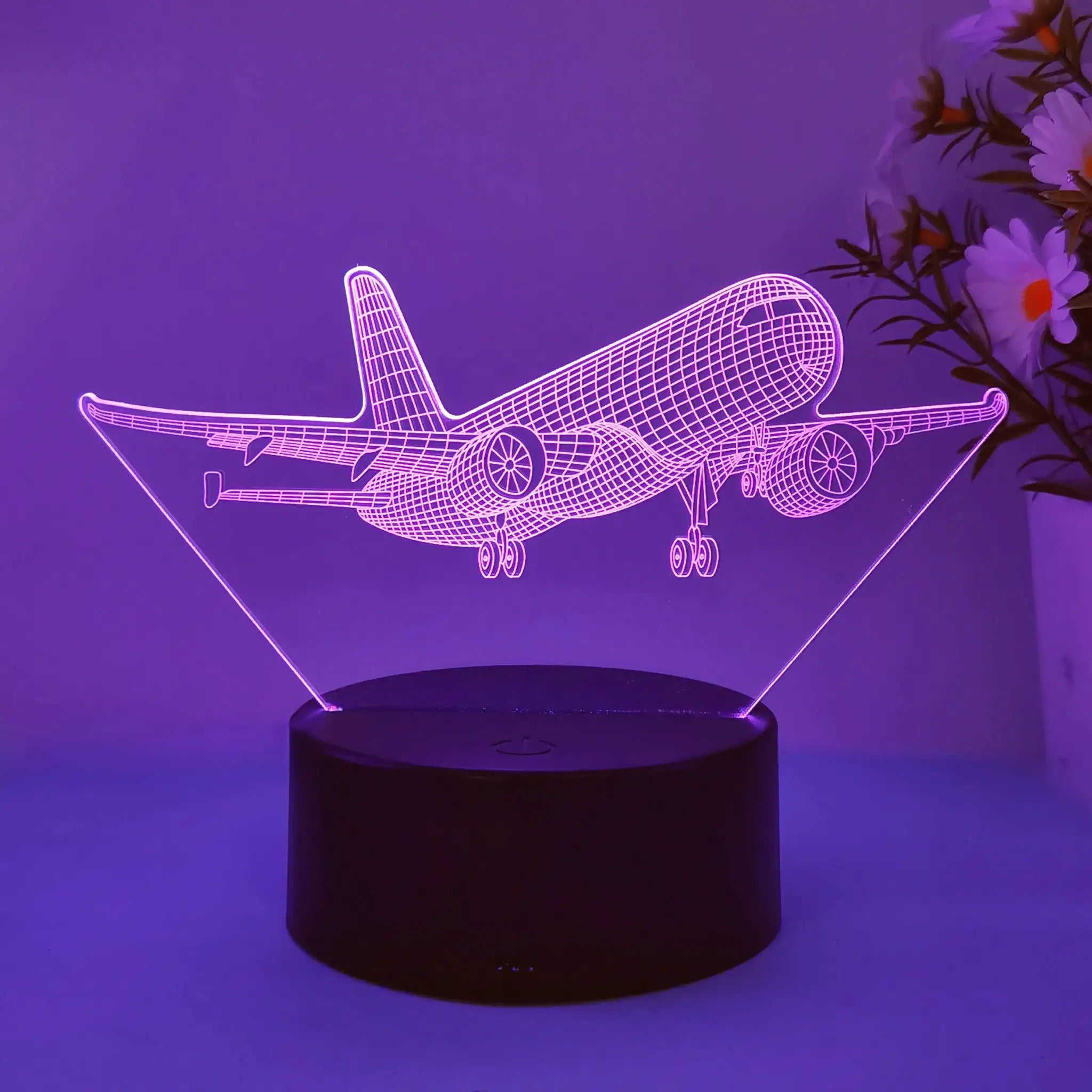 Airplane 3D night light by Simples Market; pink neon wireframe on black base with USB