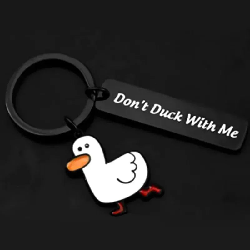 Keychain featuring a white duck charm with orange beak and red feet, black tag reads Don't Duck With Me