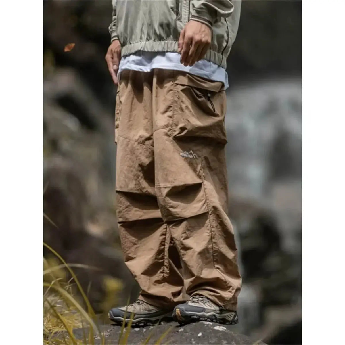 Men's tan cargo hiking pants for mountaineering with multiple pockets