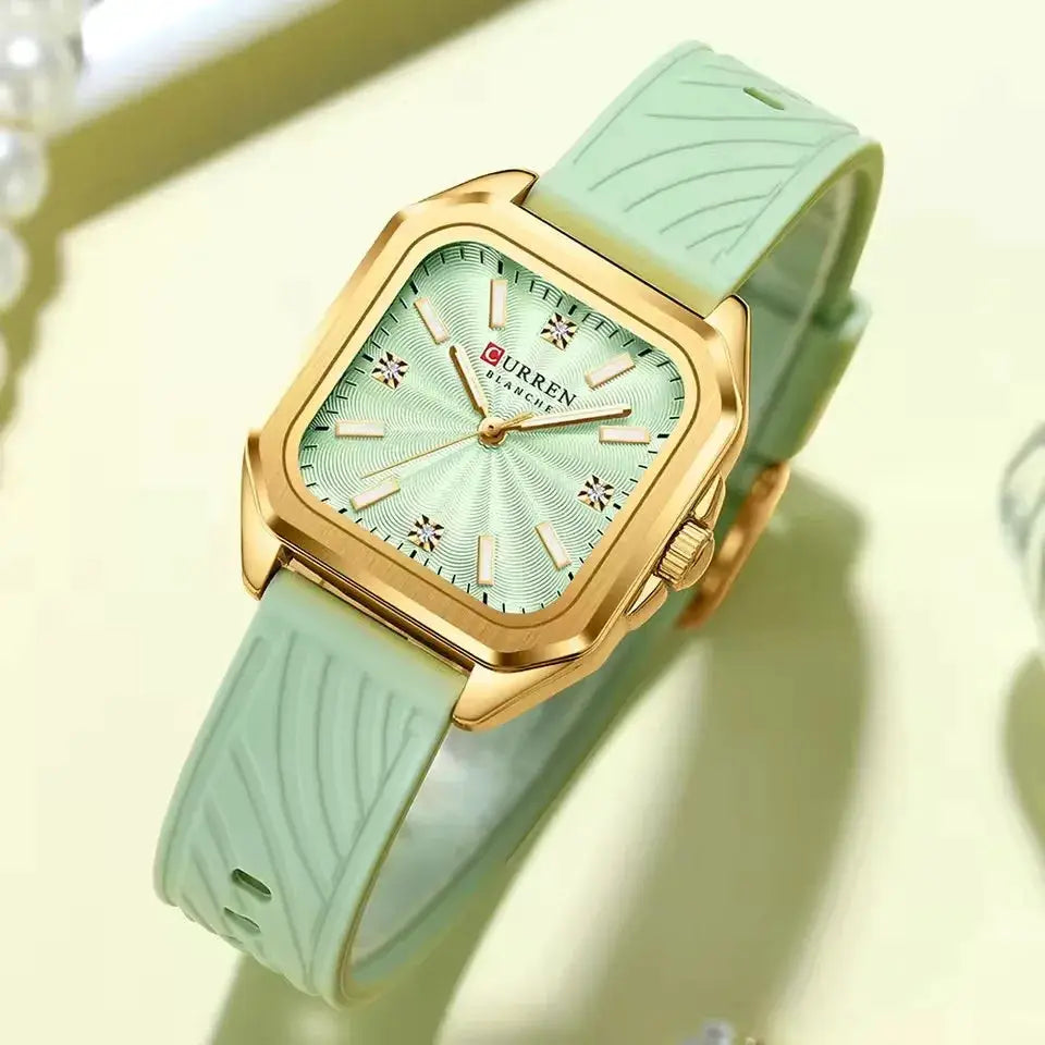 CURREN ladies square quartz watch; gold-tone case, mint green dial with crystal markers, matching mint strap.