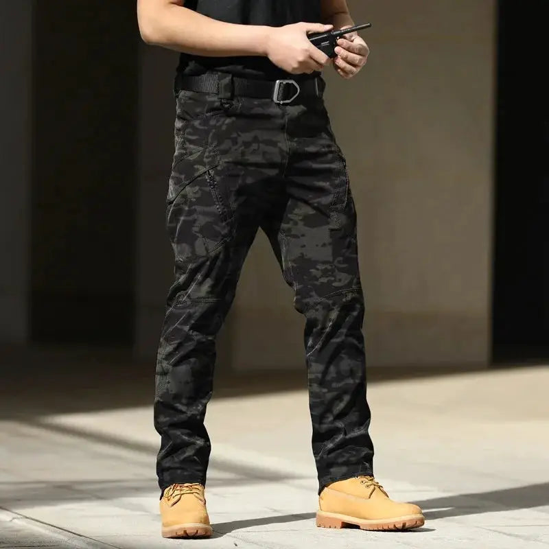 Men's tactical cargo pants - black camouflage softshell with stretch, multiple pockets, button fly