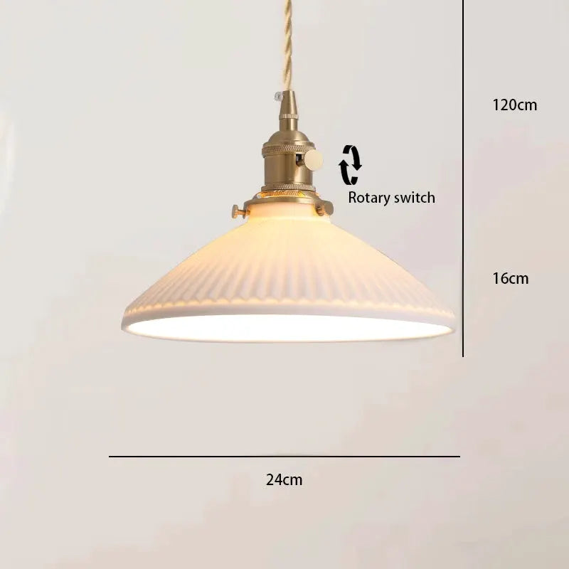 Pendant lamp with bronze hardware and ribbed glass shade, warm glow, hanging rope cord